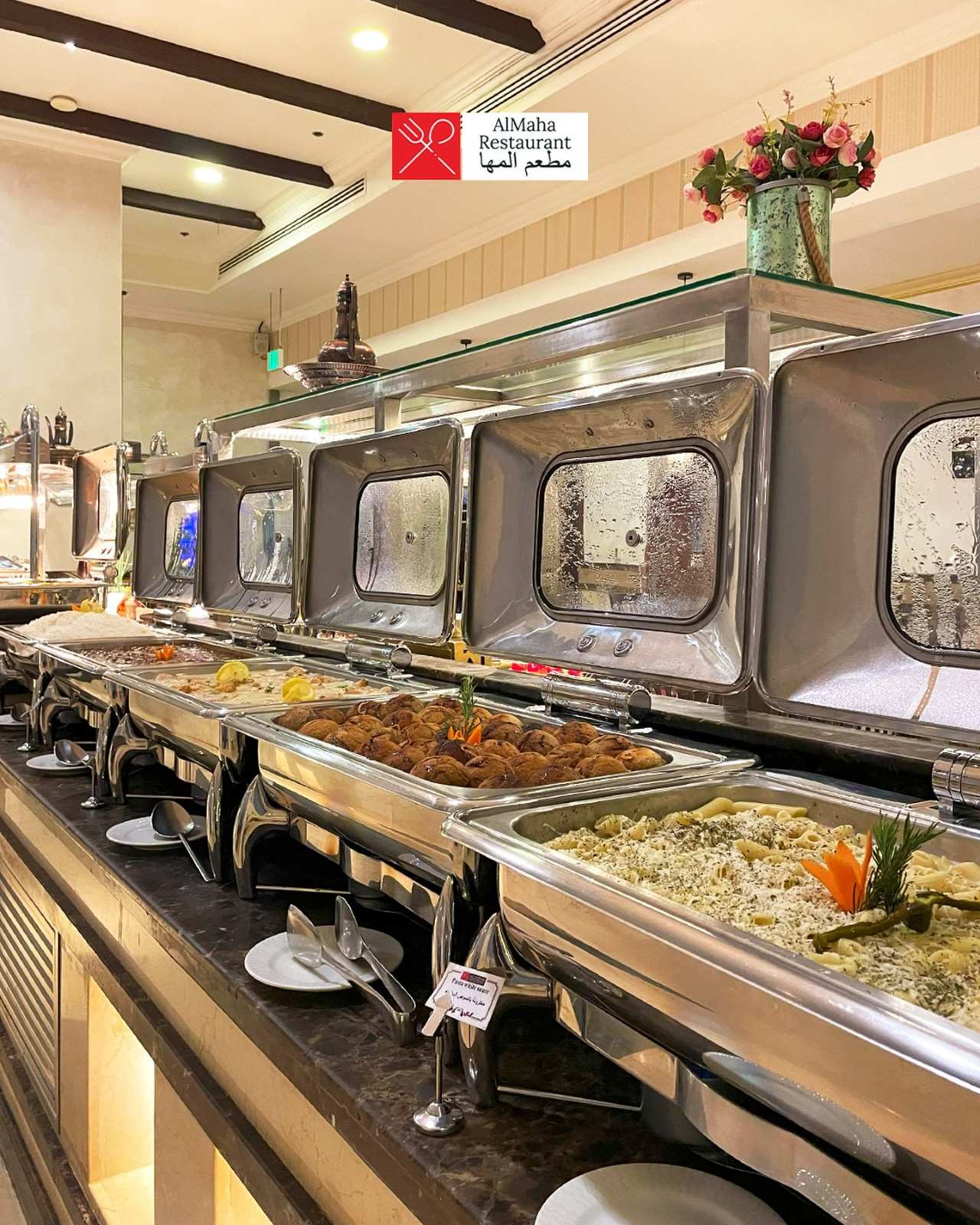 Lavish international buffet spread with multiple chafing dishes at AlMaha Restaurant within Sapphire Plaza Hotel Doha
