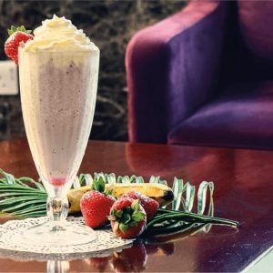 Delicious strawberry milkshake with whipped cream served at Sapphire Café in Sapphire Plaza Hotel Doha